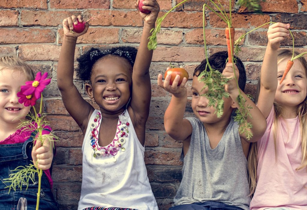 A Group of Children Holding Vegetables